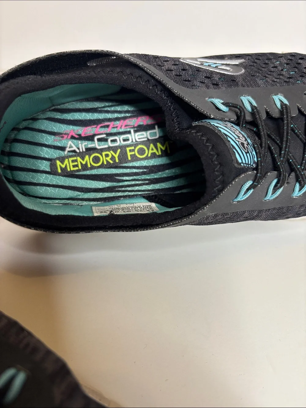 Skechers Women's Black Sneakers with Teal Accents